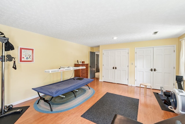 319 Powder Mill Dr, Ashland City, TN 37015 - rec room with a textured ceiling, light wood-style flooring, recessed lighting, baseboards, and visible vents