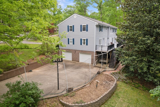 319 Powder Mill Dr, Ashland City, TN 37015 - exterior space with a garage, stairs, concrete driveway, and a wooden deck
