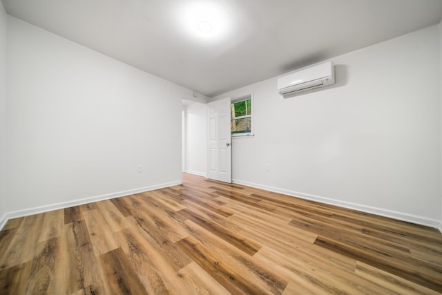 27 Cameo Dr, Nashville, TN 37211 - unfurnished room featuring baseboards, a wall unit AC, and wood finished floors
