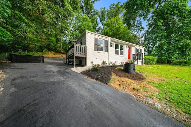 27 Cameo Dr, Nashville, TN 37211 - manufactured / mobile home with brick siding, fence, a front yard, and a deck