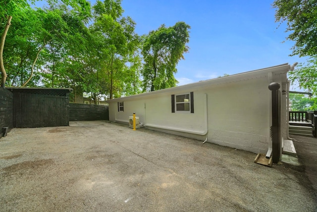 27 Cameo Dr, Nashville, TN 37211 - back of property featuring concrete block siding, a patio area, and fence