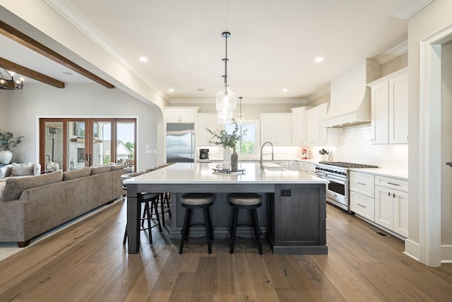 121 Dylan Woods Dr, Nolensville, TN 37135 - kitchen with open floor plan, white cabinets, a notable chandelier, and premium appliances
