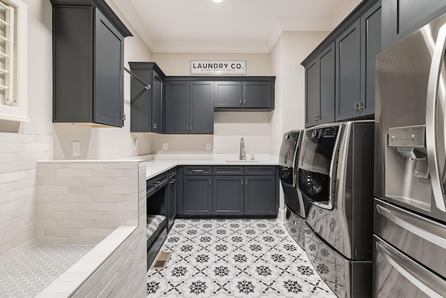 121 Dylan Woods Dr, Nolensville, TN 37135 - washroom featuring a sink, crown molding, washing machine and dryer, and cabinet space