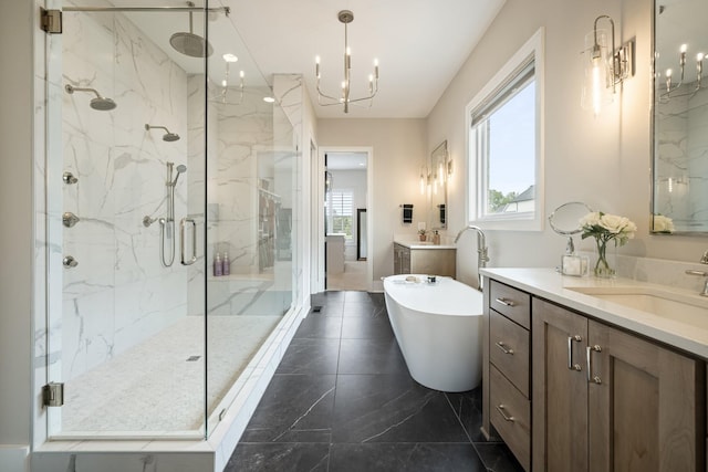 121 Dylan Woods Dr, Nolensville, TN 37135 - bathroom featuring a freestanding tub, two vanities, a sink, an inviting chandelier, and a marble finish shower