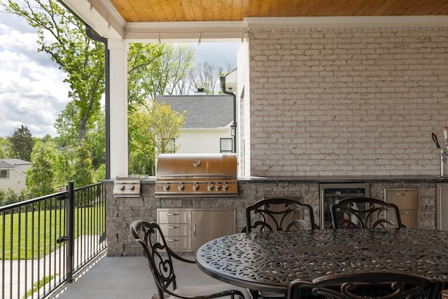 121 Dylan Woods Dr, Nolensville, TN 37135 - balcony featuring beverage cooler, exterior kitchen, outdoor dining area, and grilling area