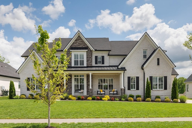 121 Dylan Woods Dr, Nolensville, TN 37135 - view of front of property with a porch, brick siding, a standing seam roof, and a front lawn