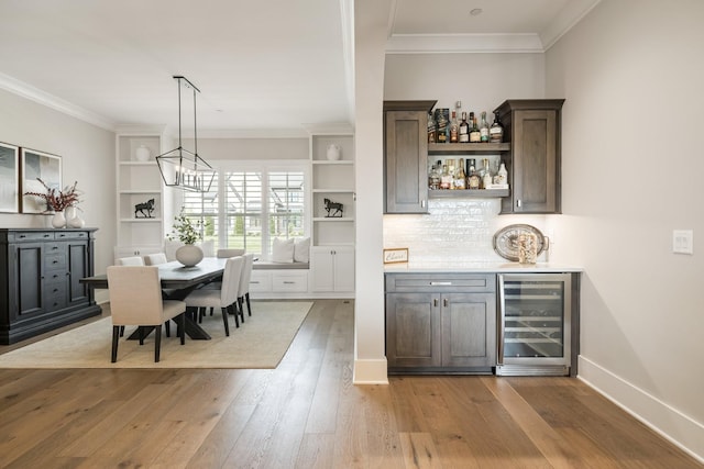 121 Dylan Woods Dr, Nolensville, TN 37135 - bar with crown molding, a bar, wood-type flooring, and beverage cooler