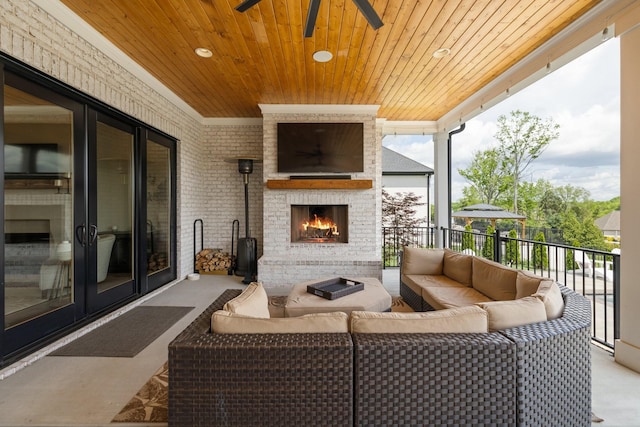 121 Dylan Woods Dr, Nolensville, TN 37135 - view of patio / terrace featuring ceiling fan and an outdoor living space with a fireplace