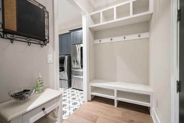 121 Dylan Woods Dr, Nolensville, TN 37135 - mudroom with ornamental molding, light wood-style flooring, and washer / clothes dryer