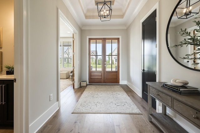 121 Dylan Woods Dr, Nolensville, TN 37135 - doorway to outside with ornamental molding, a tray ceiling, a notable chandelier, and dark wood-style floors
