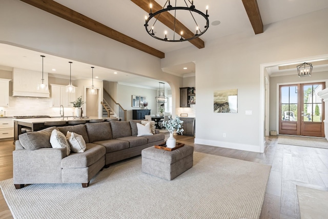 121 Dylan Woods Dr, Nolensville, TN 37135 - living room with an inviting chandelier, recessed lighting, light wood-style flooring, and beamed ceiling