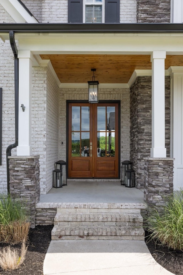 121 Dylan Woods Dr, Nolensville, TN 37135 - view of exterior entry with a porch, french doors, and brick siding