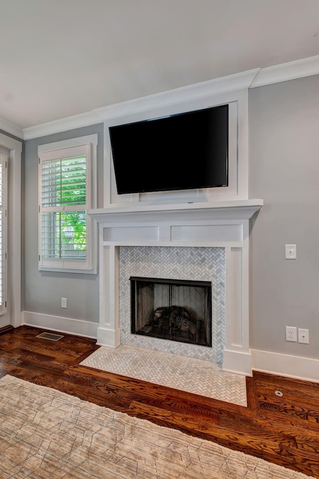 503B Acklen Park Dr, Nashville, TN 37205 - interior details featuring visible vents, a tiled fireplace, wood finished floors, baseboards, and ornamental molding