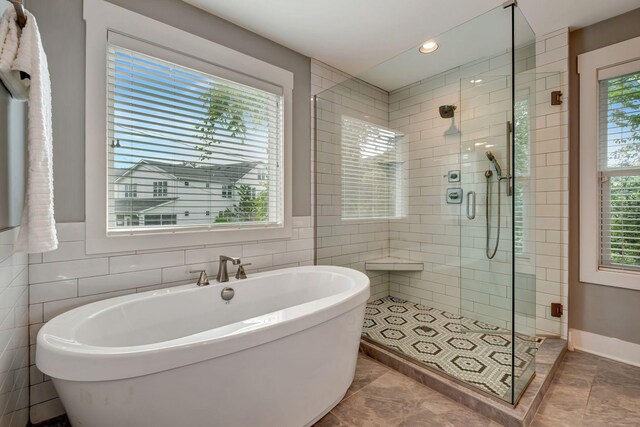 503B Acklen Park Dr, Nashville, TN 37205 - full bathroom with recessed lighting, a freestanding tub, tile walls, and a shower stall