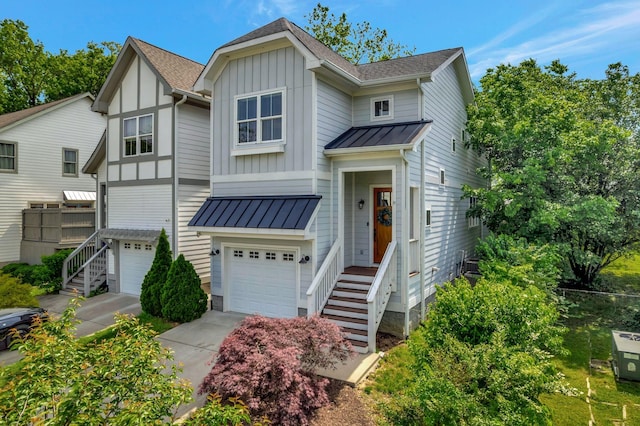 503B Acklen Park Dr, Nashville, TN 37205 - view of front of house with a shingled roof, a garage, board and batten siding, a standing seam roof, and metal roof