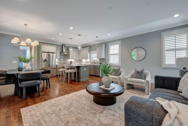 503B Acklen Park Dr, Nashville, TN 37205 - living area with recessed lighting, ornamental molding, dark wood-style floors, and a notable chandelier