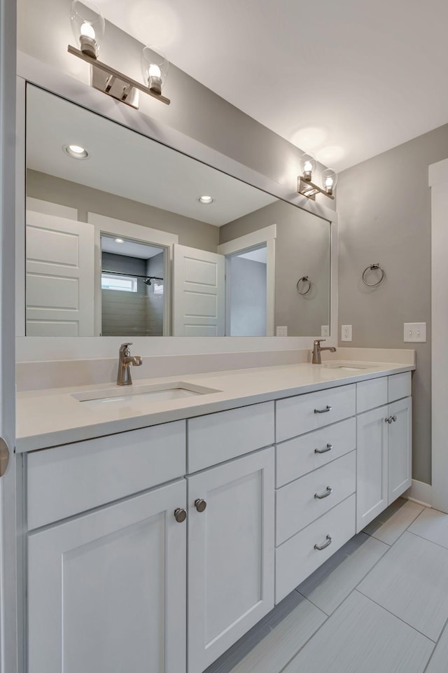 503B Acklen Park Dr, Nashville, TN 37205 - bathroom featuring double vanity, a sink, and walk in shower