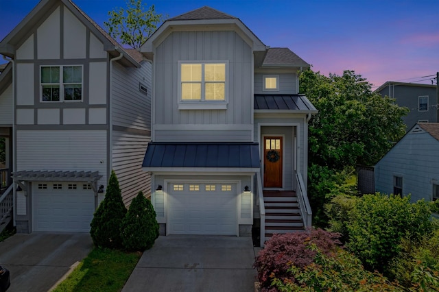 503B Acklen Park Dr, Nashville, TN 37205 - view of front of house with an attached garage, concrete driveway, board and batten siding, and a standing seam roof