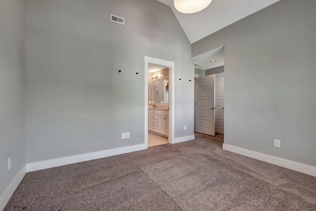 503B Acklen Park Dr, Nashville, TN 37205 - unfurnished bedroom featuring connected bathroom, light carpet, high vaulted ceiling, baseboards, and visible vents