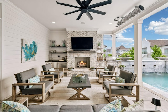 view of patio with area for grilling, an outdoor living space, and a ceiling fan