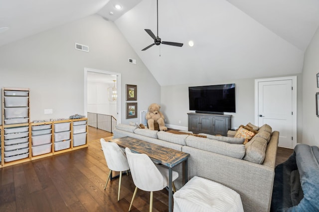 living room featuring high vaulted ceiling, ceiling fan, dark wood-style flooring, and visible vents