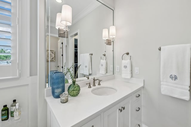 bathroom with vanity and crown molding