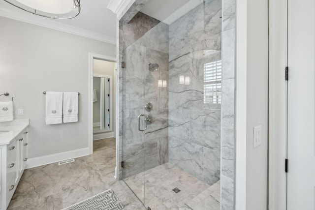 bathroom with baseboards, vanity, marble finish floor, a marble finish shower, and ornamental molding
