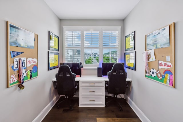 office space featuring baseboards and dark wood-style flooring