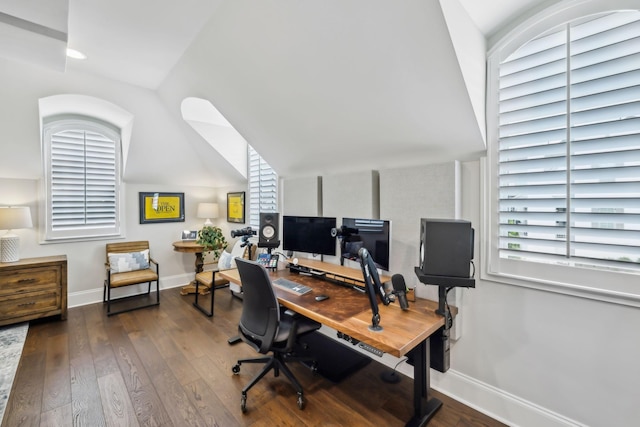 office space featuring baseboards, lofted ceiling, and hardwood / wood-style flooring