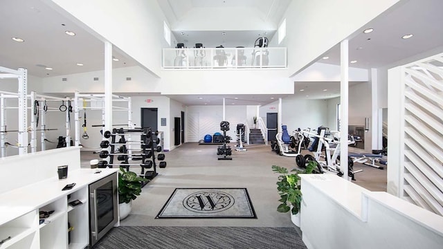 workout area with recessed lighting and a high ceiling