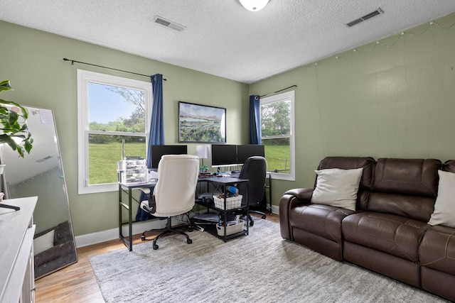 3610 Gleason Dr, Chattanooga, TN 37412 - office featuring baseboards, a textured ceiling, visible vents, and wood finished floors