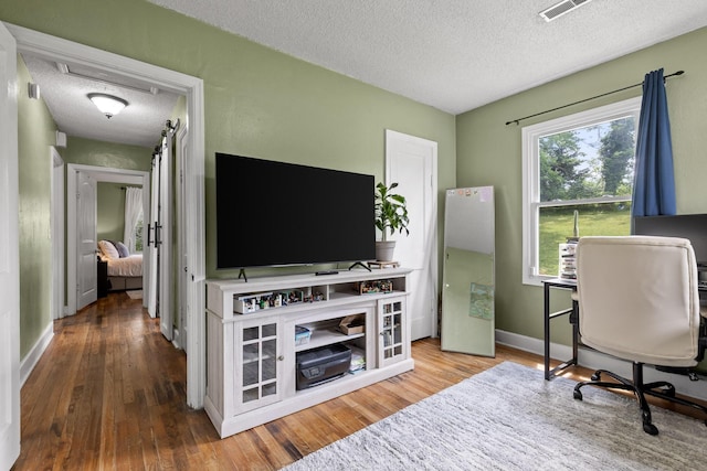 3610 Gleason Dr, Chattanooga, TN 37412 - office space with a textured ceiling, visible vents, and wood finished floors