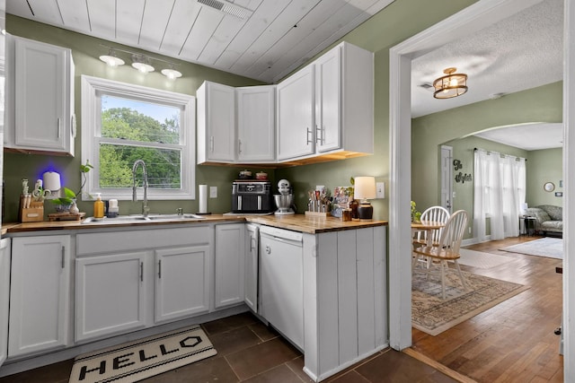 3610 Gleason Dr, Chattanooga, TN 37412 - kitchen featuring a healthy amount of sunlight, butcher block countertops, white dishwasher, arched walkways, and a sink
