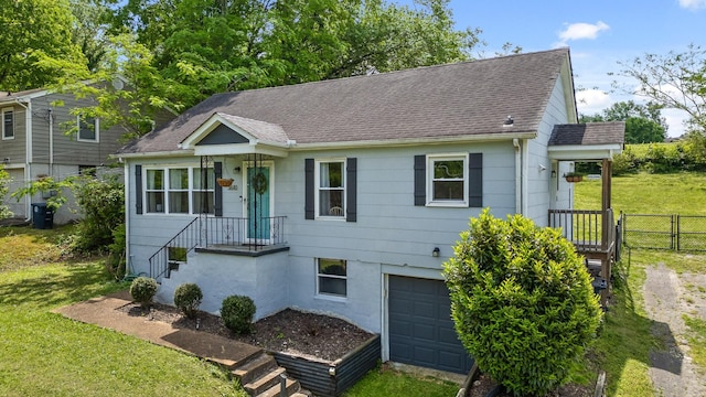 3610 Gleason Dr, Chattanooga, TN 37412 - ranch-style house with a garage, a front lawn, roof with shingles, and fence