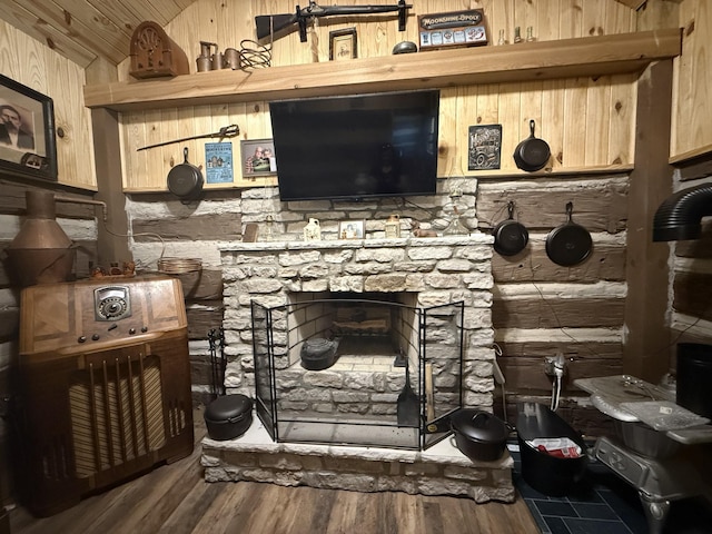 8901 Primm Springs Rd, Primm Springs, TN 38476 - room details with wood walls, a fireplace, and wood finished floors