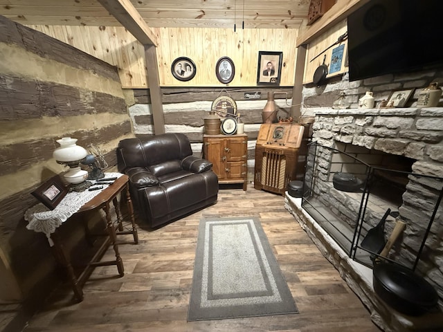 8901 Primm Springs Rd, Primm Springs, TN 38476 - living area with wood walls, a fireplace, and wood finished floors
