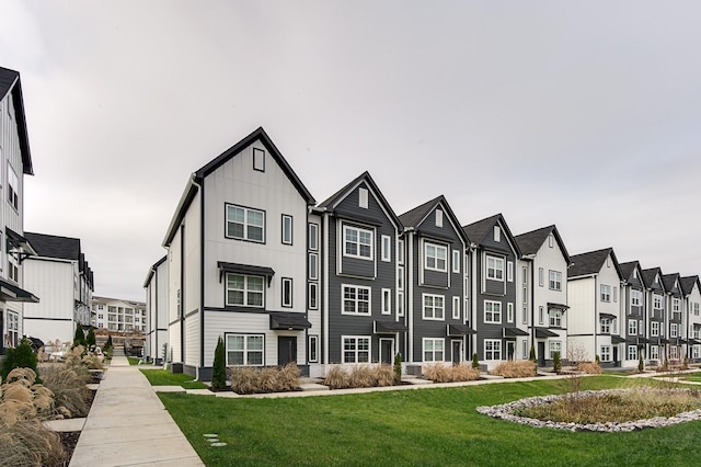 exterior space featuring a residential view and a lawn