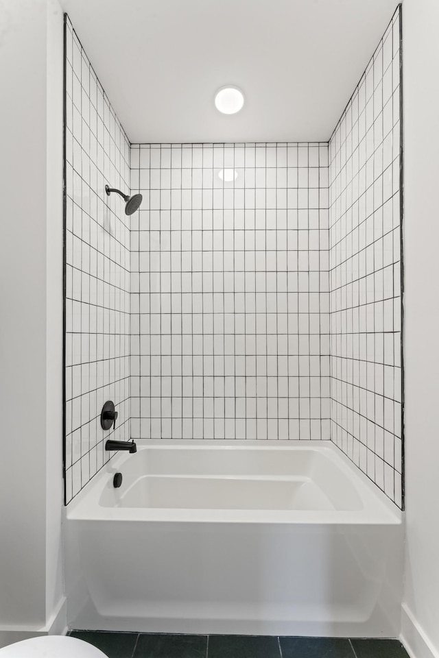 full bath with tile patterned floors, baseboards, toilet, and shower / bathtub combination