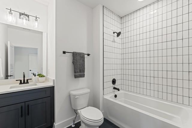 full bath with visible vents, shower / washtub combination, baseboards, vanity, and toilet