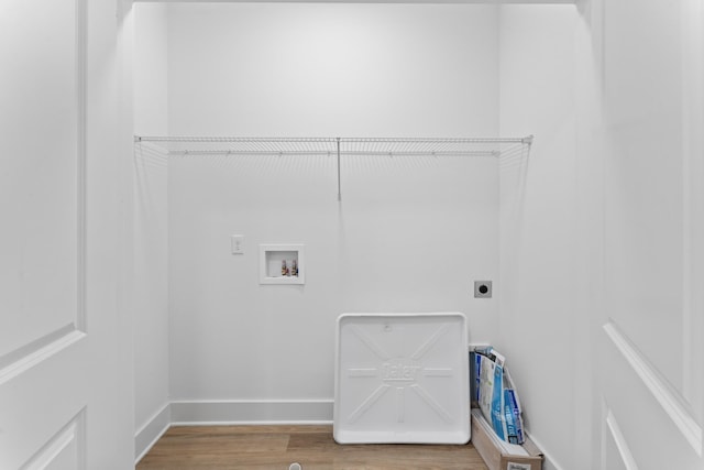 laundry area featuring hookup for an electric dryer, laundry area, wood finished floors, baseboards, and hookup for a washing machine
