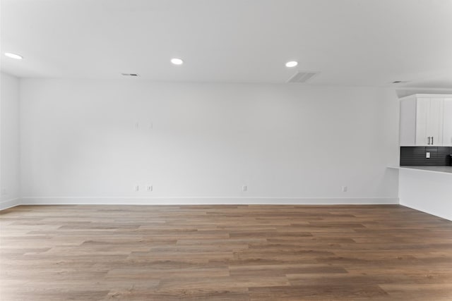 unfurnished living room featuring recessed lighting, baseboards, visible vents, and light wood-style floors