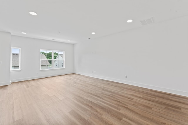 spare room with recessed lighting, visible vents, and light wood-style flooring