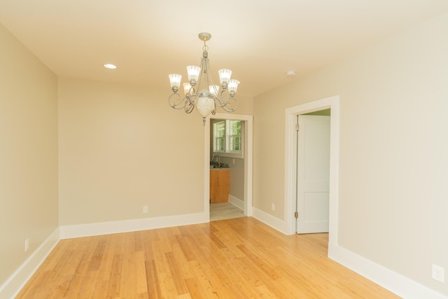 716 Larkin Ave, Chattanooga, TN 37411 - spare room with light wood finished floors, a notable chandelier, baseboards, and recessed lighting