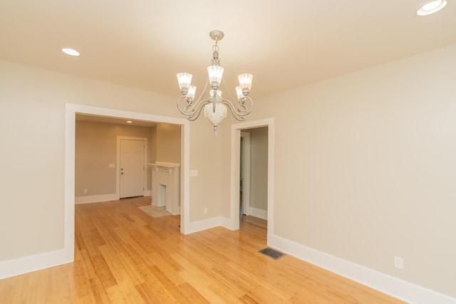 716 Larkin Ave, Chattanooga, TN 37411 - empty room featuring visible vents, baseboards, light wood-style floors, a chandelier, and recessed lighting