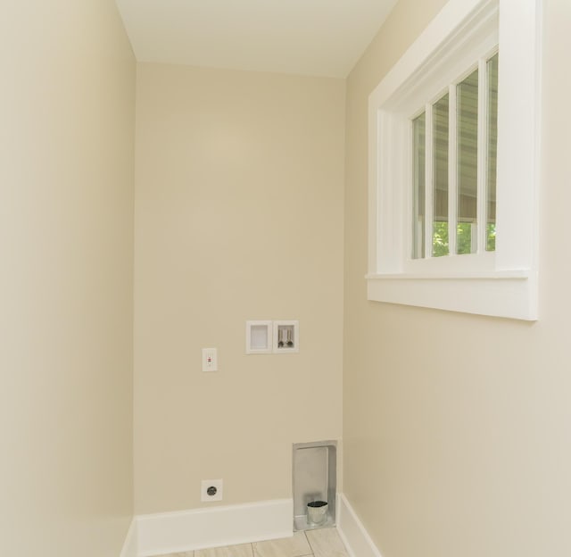 716 Larkin Ave, Chattanooga, TN 37411 - washroom with baseboards, hookup for an electric dryer, laundry area, and hookup for a washing machine