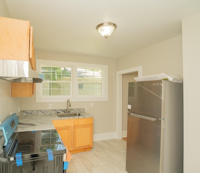 716 Larkin Ave, Chattanooga, TN 37411 - kitchen with baseboards, range hood, light stone counters, a sink, and appliances with stainless steel finishes