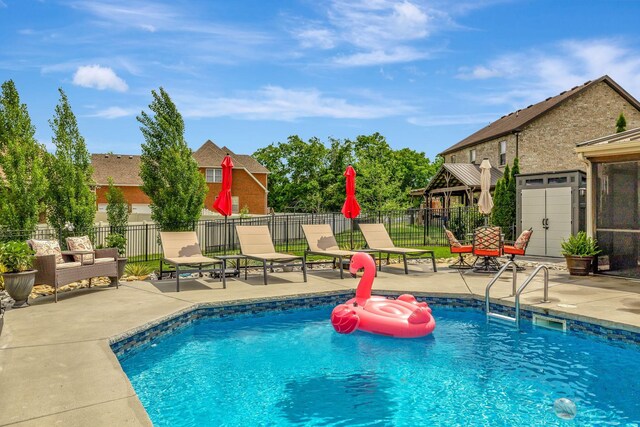 view of swimming pool featuring fence, a patio area, and a fenced in pool