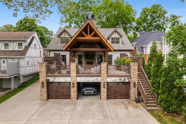208 Carden Ave, Nashville, TN 37205 - view of front of property featuring driveway, a chimney, roof with shingles, a garage, and stone siding