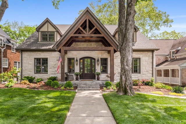 208 Carden Ave, Nashville, TN 37205 - view of front of property featuring a shingled roof, stone siding, and a front lawn