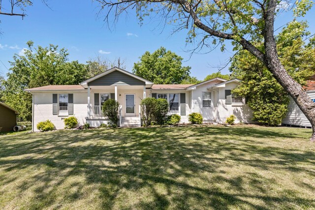 2821 Galesburg Dr, Nashville, TN 37217 - ranch-style house featuring a porch, brick siding, and a front lawn